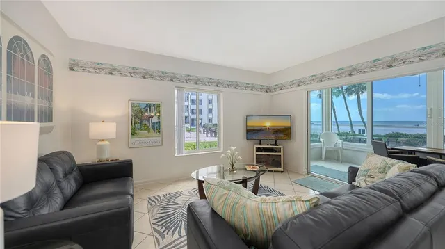 a living room with furniture fireplace and a flat screen tv
