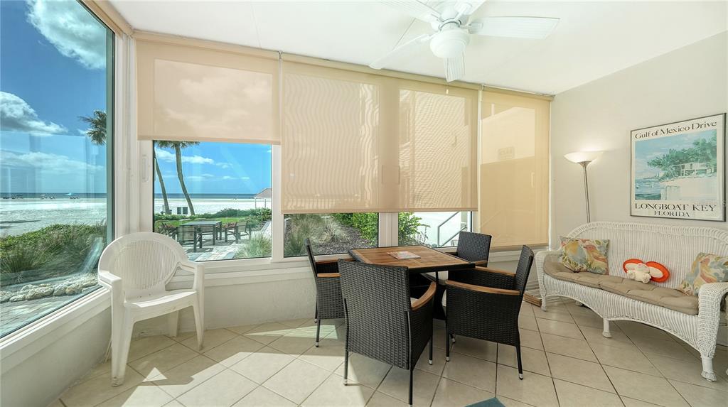 6144 Midnight Pass Road, Unit 2N Sarasota, FL 34242 - Photo 7 of 53 a dining room with furniture and a window