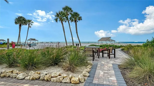 a view of a swimming pool with a table and chairs