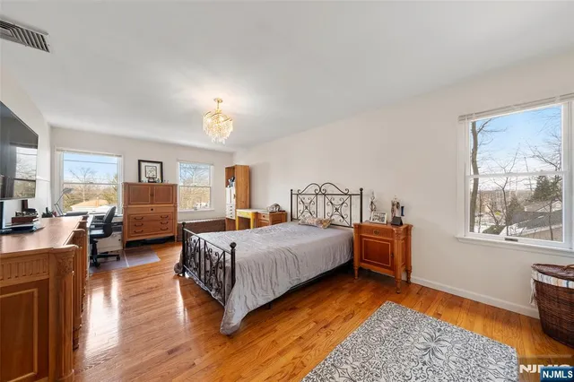 a bed room with bed and window