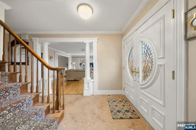 a view of an entryway with wooden floor