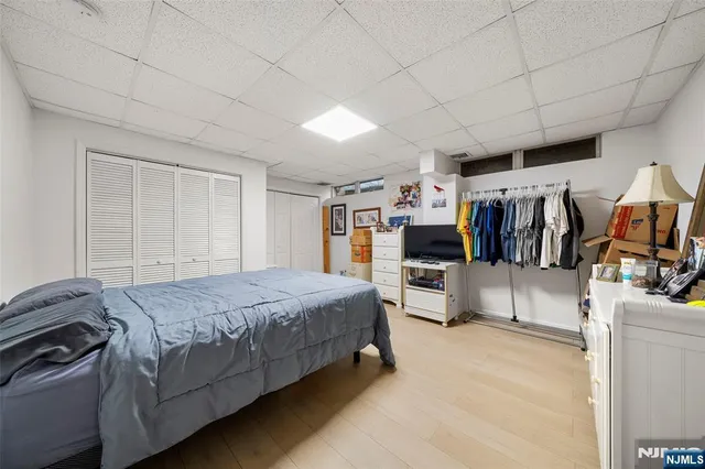 a bedroom with a bed and a walk in closet