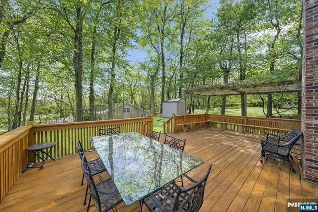 a view of a chairs and table on the wooden floor
