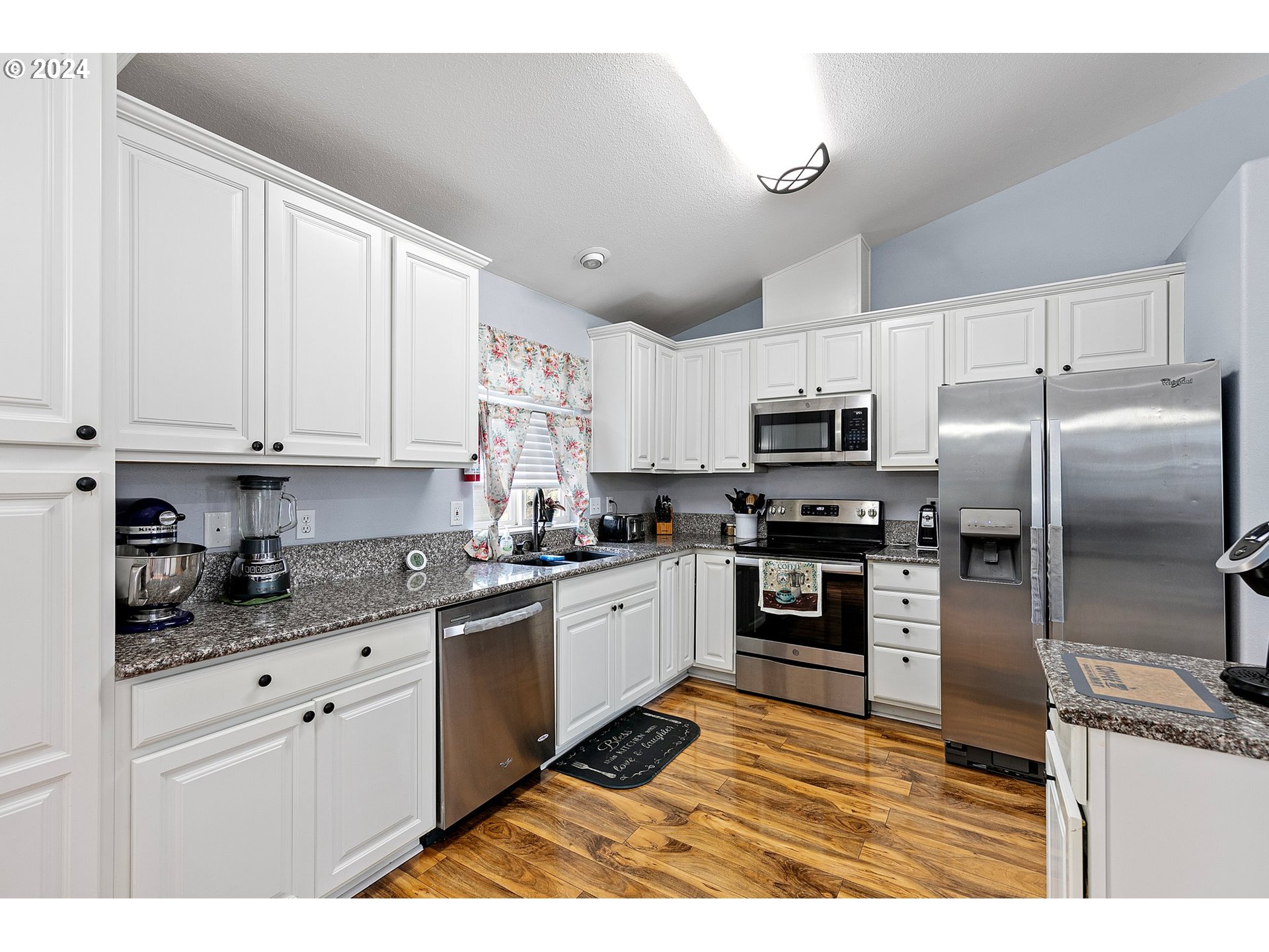 660 South 41st Place Springfield, OR 97478 - Photo 12 of 39 a kitchen with stainless steel appliances granite countertop a refrigerator stove top oven and sink