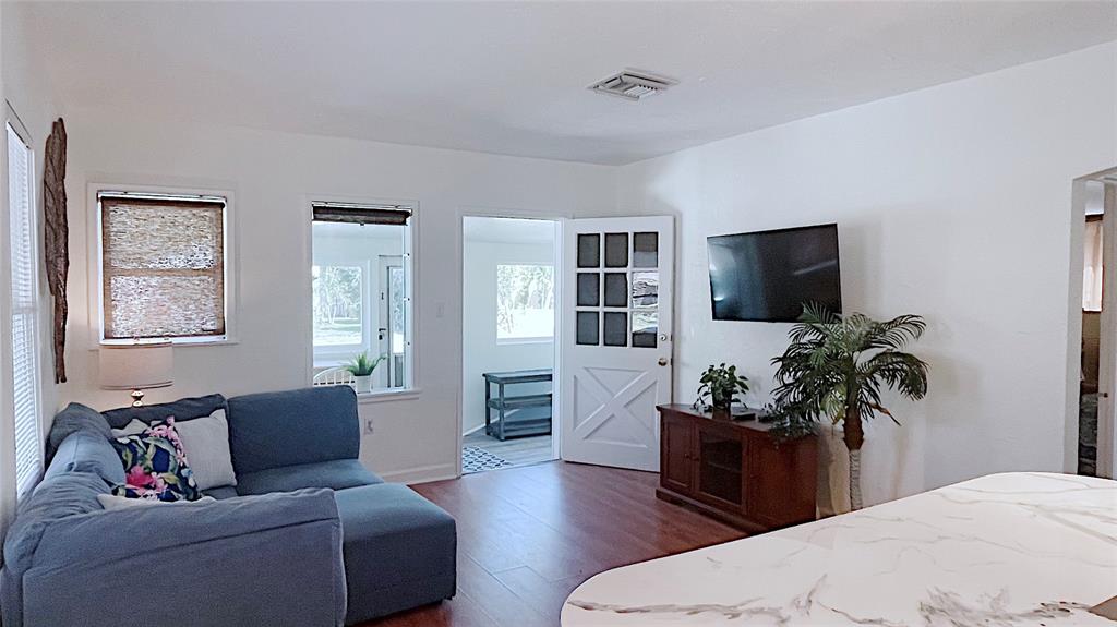 342 Southwest 2nd Avenue Dania Beach, FL 33004 - Photo 13 of 27 a living room with furniture flat screen tv and window