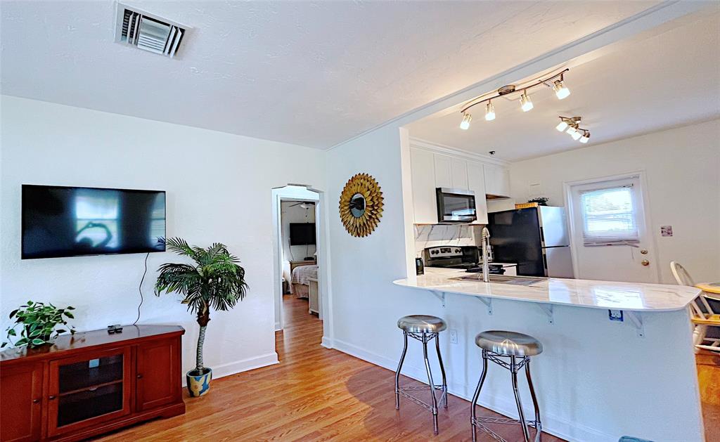 342 Southwest 2nd Avenue Dania Beach, FL 33004 - Photo 14 of 27 a living room with furniture and a flat screen tv