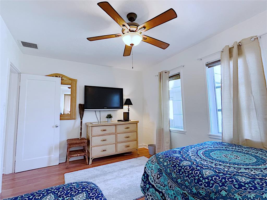 342 Southwest 2nd Avenue Dania Beach, FL 33004 - Photo 22 of 27 a bedroom with a bed and flat screen tv