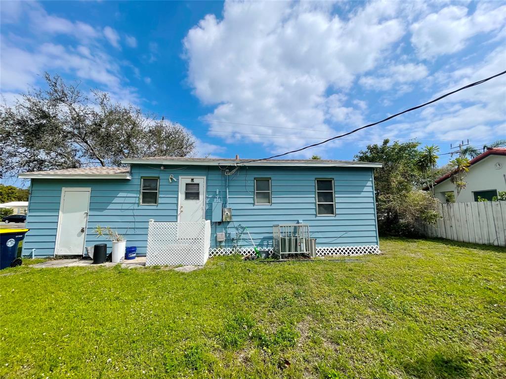 342 Southwest 2nd Avenue Dania Beach, FL 33004 - Photo 6 of 27 a backyard of a house with table and chairs