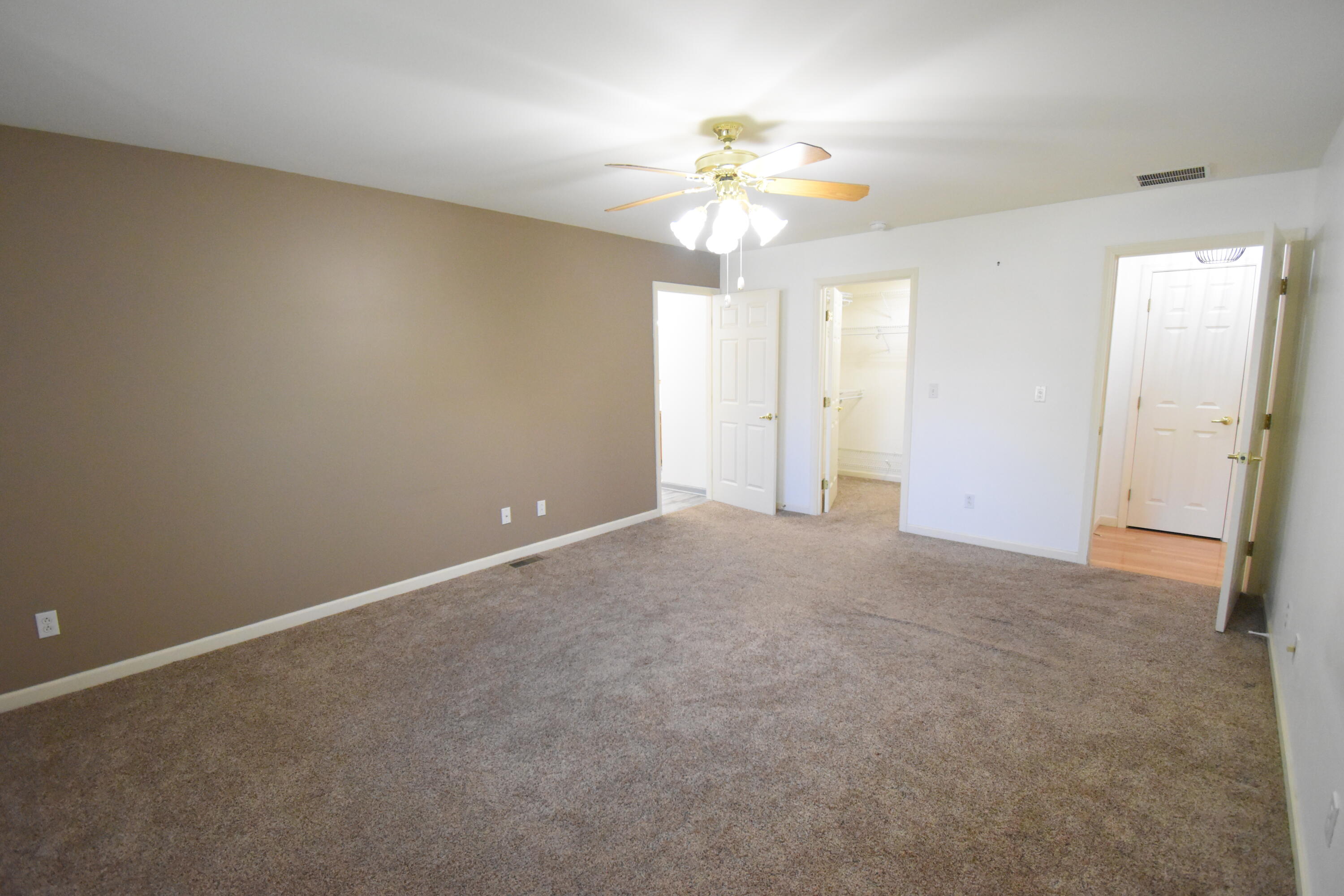 522 Pheasant Run Rensselaer, IN 47978 - Photo 35 of 55 a view of an empty room with a chandelier fan