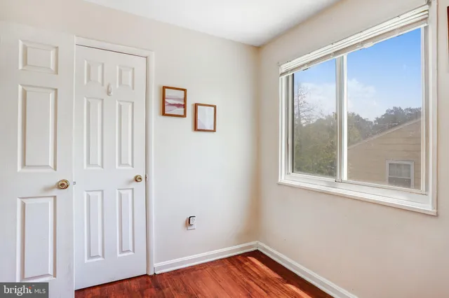 a view of front door with wooden floor