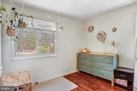 a room with toys and dresser