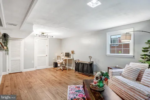 a bedroom with furniture and a potted plant