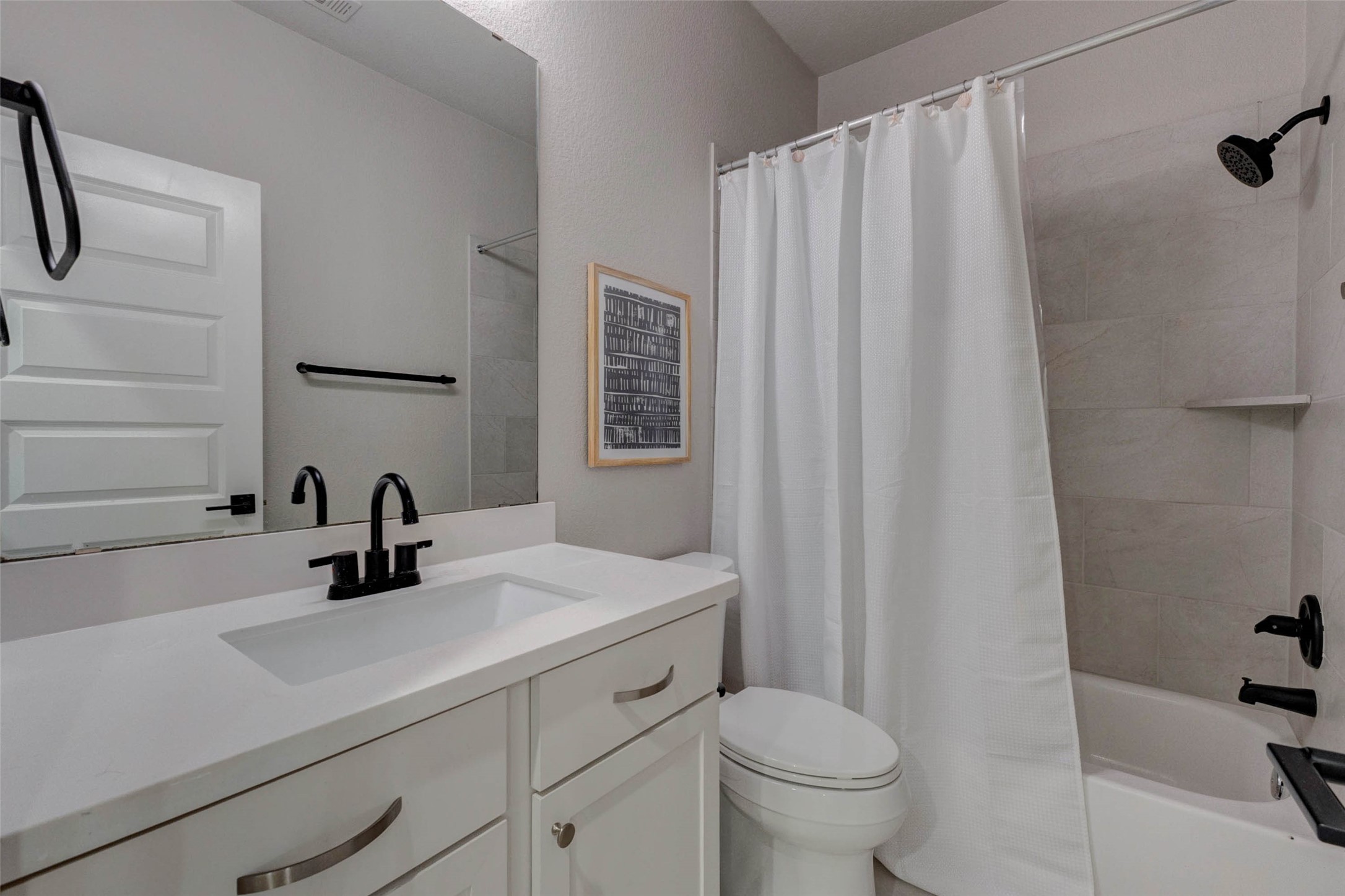4303 Tupelo Leaf Court Manvel, TX 77578 - Photo 45 of 50 a bathroom with a sink a toilet and shower curtain