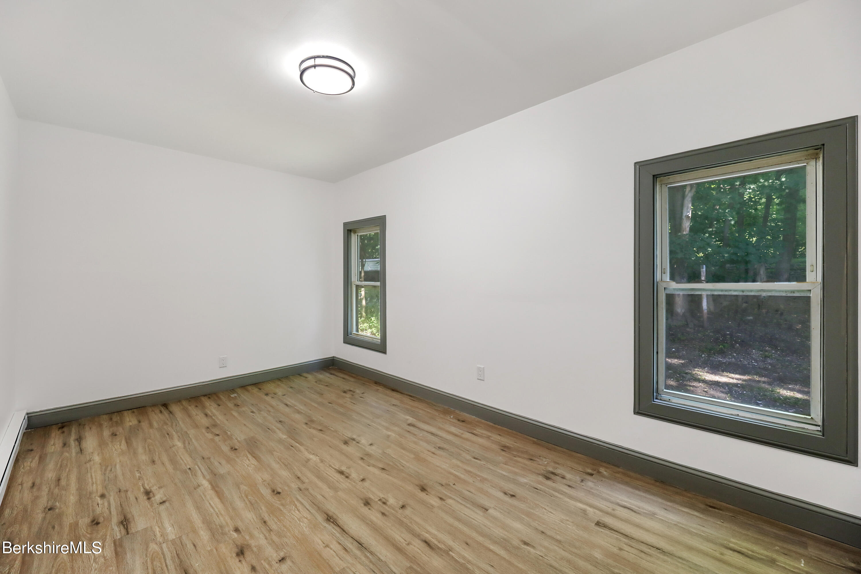 33-35 Hall Street North Adams, MA 01247 - Photo 18 of 44 a view of an empty room with wooden floor and a window