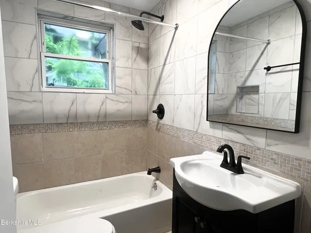 a view of a storage and utility room with racks on the wall