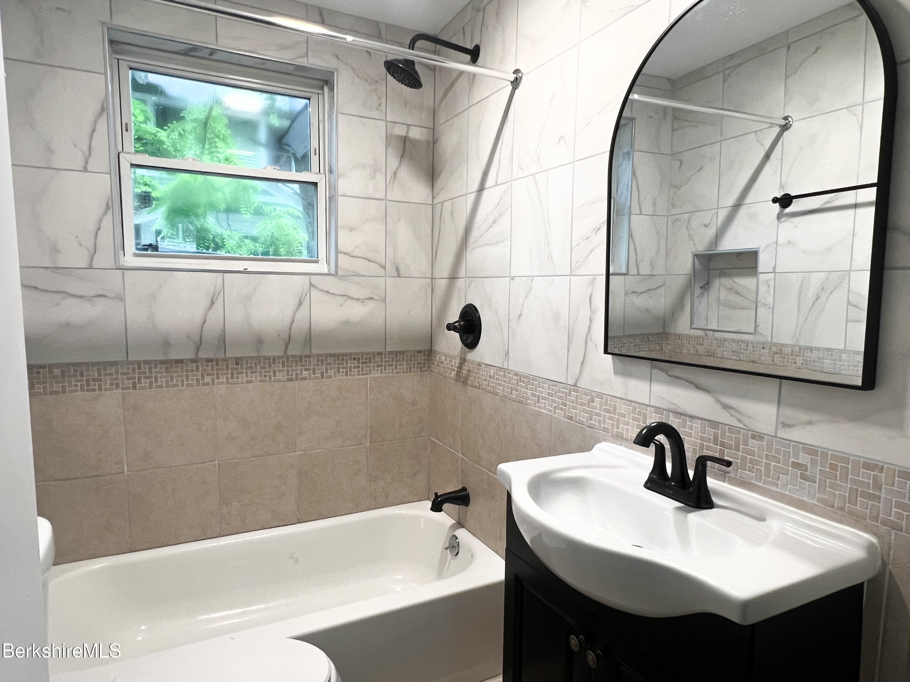 33-35 Hall Street North Adams, MA 01247 - Photo 39 of 44 a bathroom with a sink and a mirror