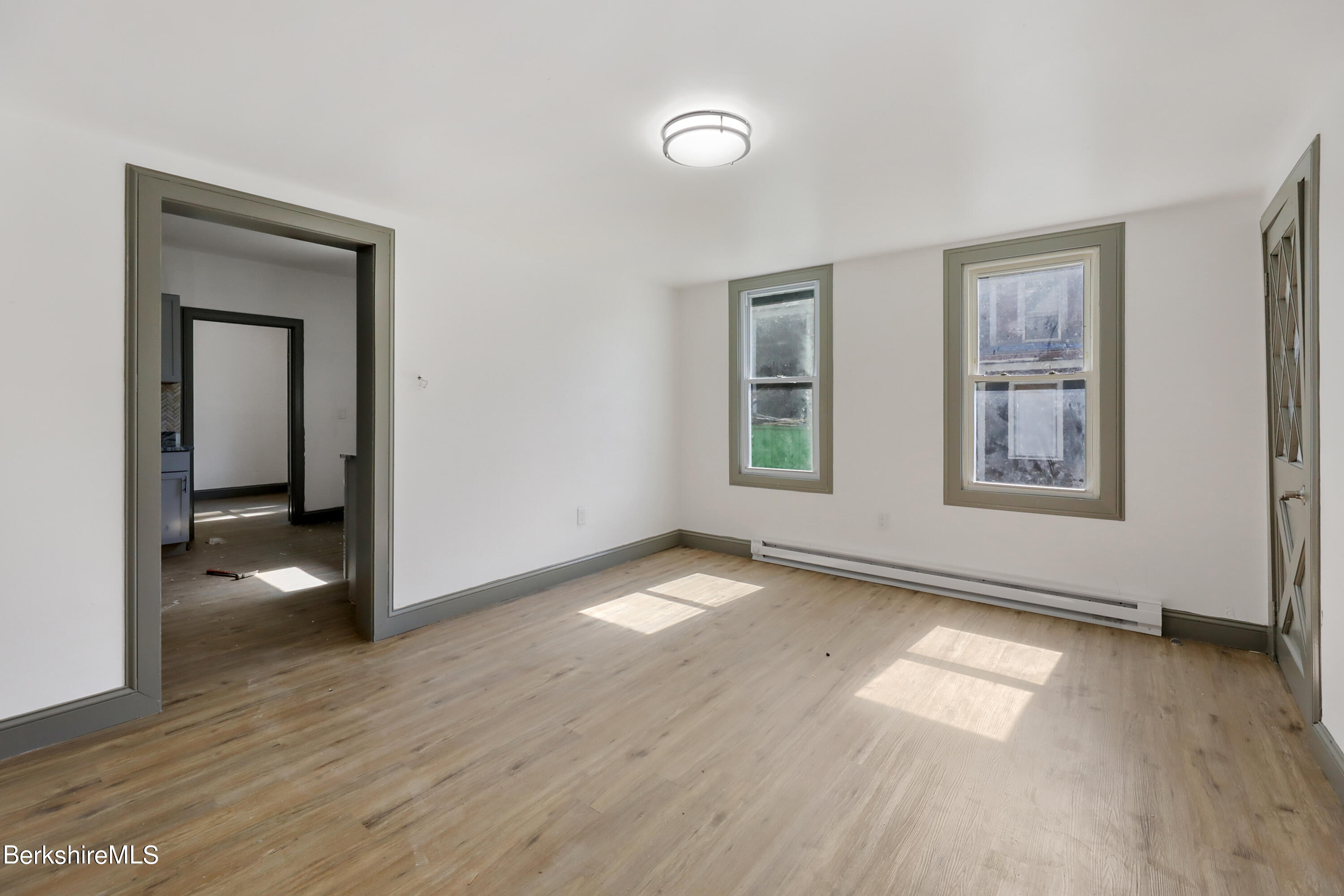 33-35 Hall Street North Adams, MA 01247 - Photo 8 of 44 a view of an empty room with window and wooden floor