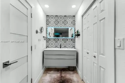 a bathroom with a shower and a sink