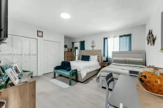 a bedroom with furniture and a fireplace