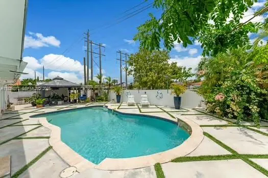 a view of a swimming pool with a patio