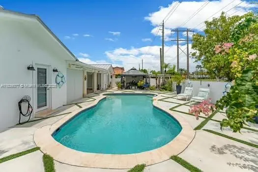 a view of a swimming pool with a lounge chairs