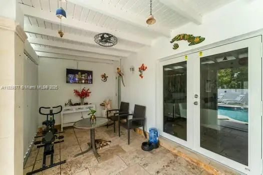 a view of a livingroom with furniture and a window