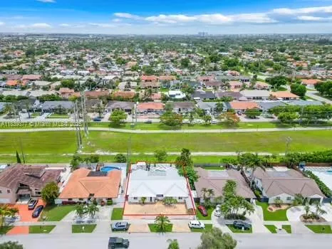 an aerial view of a city with a lake view and a lake view in back