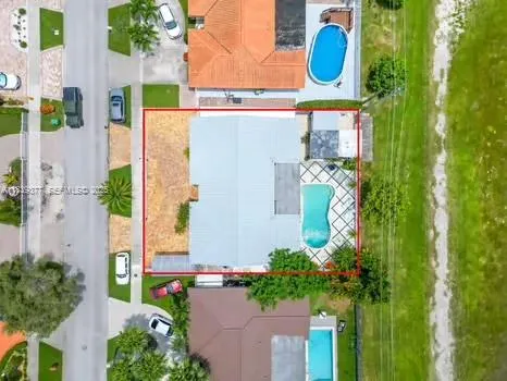 aerial view of a house with plants and flowers
