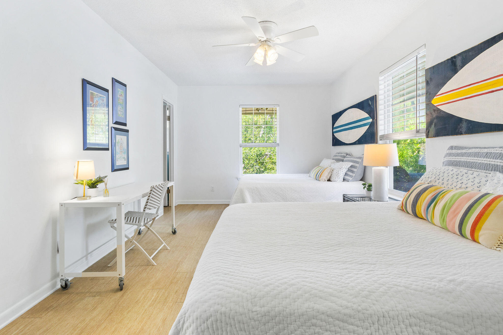 81 San Juan Avenue Santa Rosa Beach, FL 32459 - Photo 12 of 33 a bedroom with a bed a table and chair