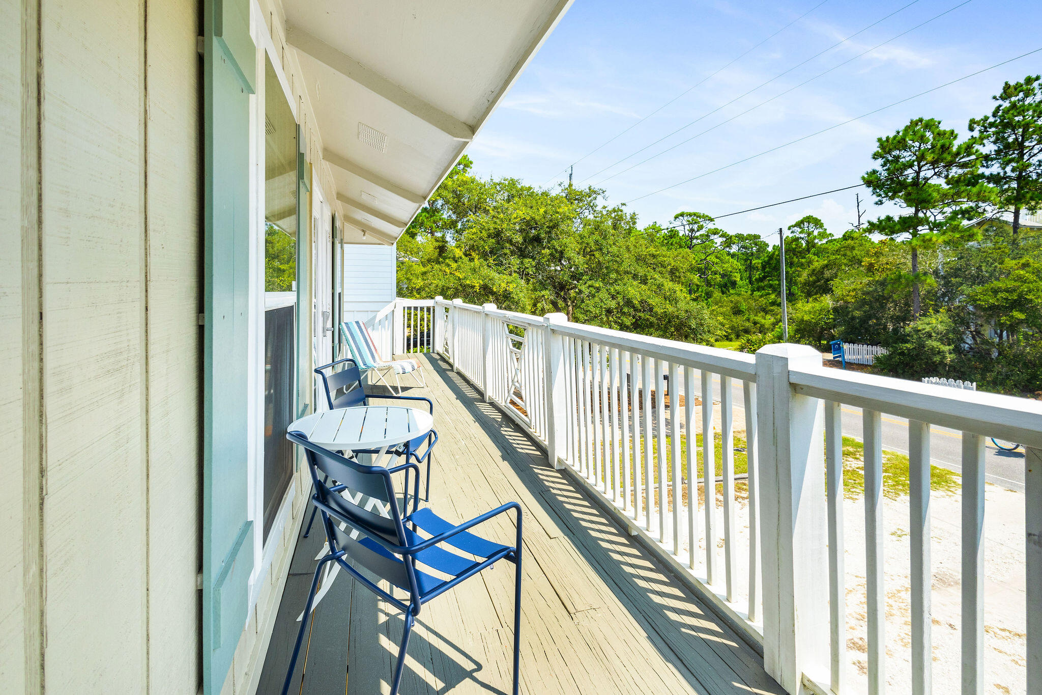 81 San Juan Avenue Santa Rosa Beach, FL 32459 - Photo 18 of 33 a view of a balcony with furniture