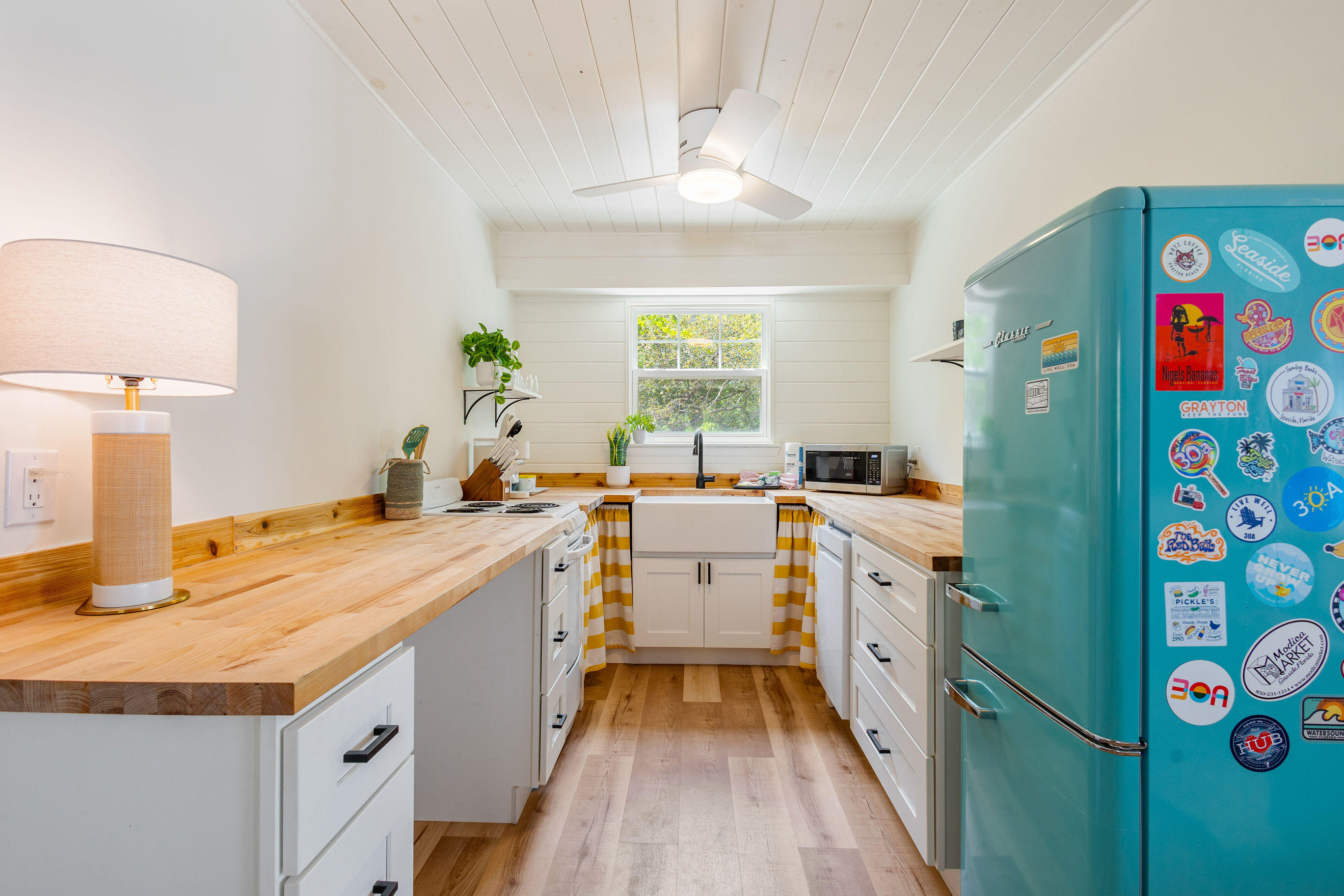 81 San Juan Avenue Santa Rosa Beach, FL 32459 - Photo 20 of 33 a kitchen with a sink stove and refrigerator