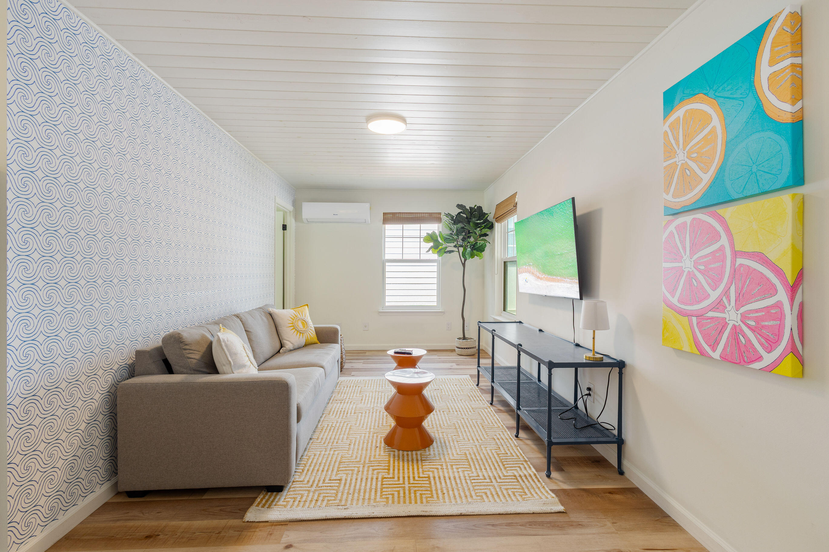 81 San Juan Avenue Santa Rosa Beach, FL 32459 - Photo 23 of 33 a living room with patio furniture and a potted plant