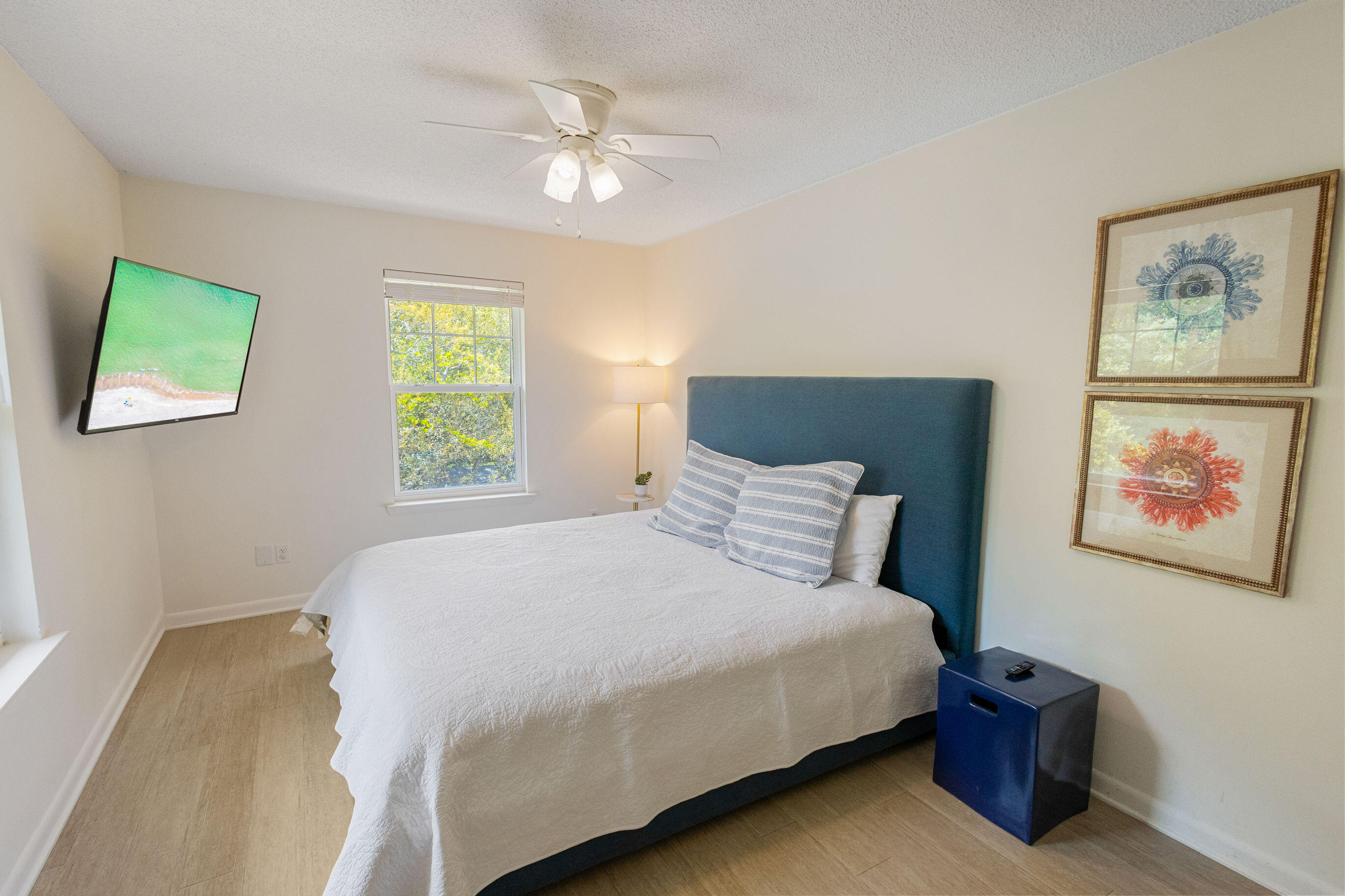 81 San Juan Avenue Santa Rosa Beach, FL 32459 - Photo 26 of 33 a bedroom with a bed and a painting on the wall
