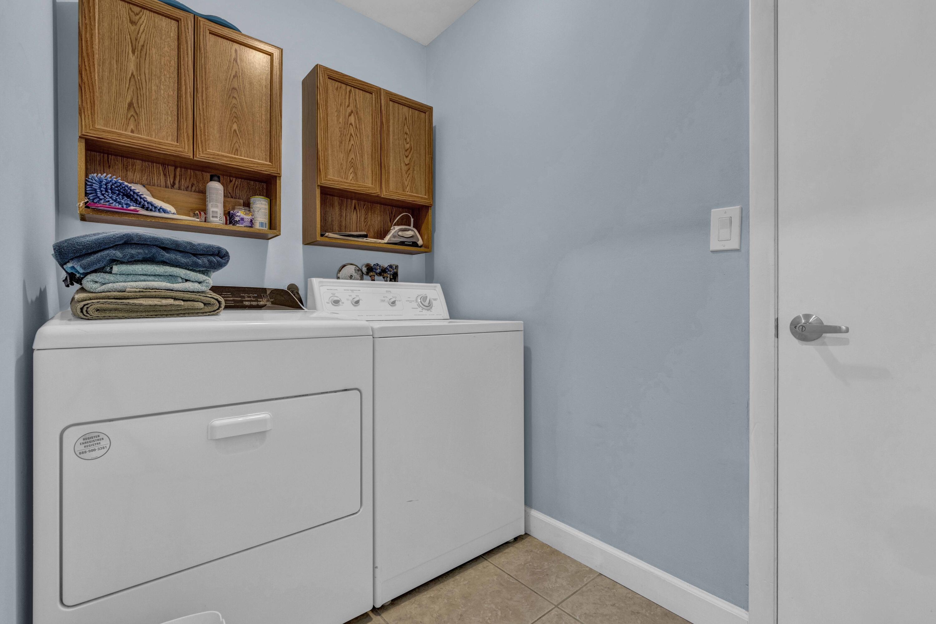 22323 Martella Avenue Boca Raton, FL 33433 - Photo 16 of 21 a utility room with dryer and washer