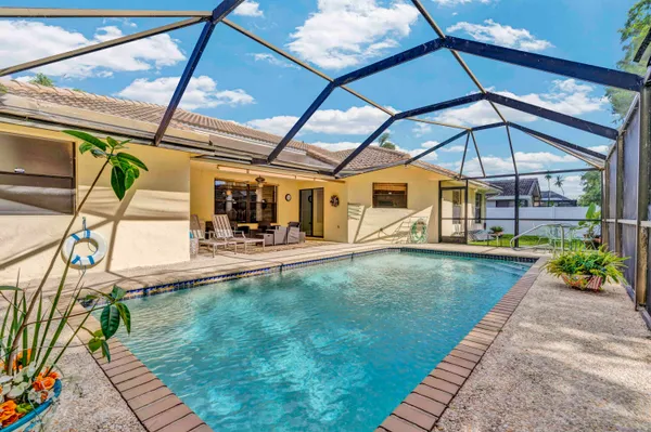 a view of a swimming pool with a patio