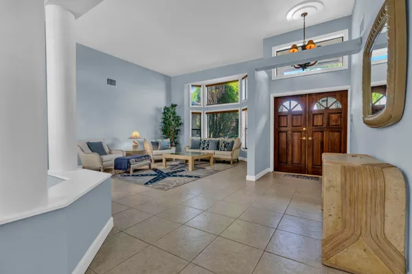 a living room with furniture and a window