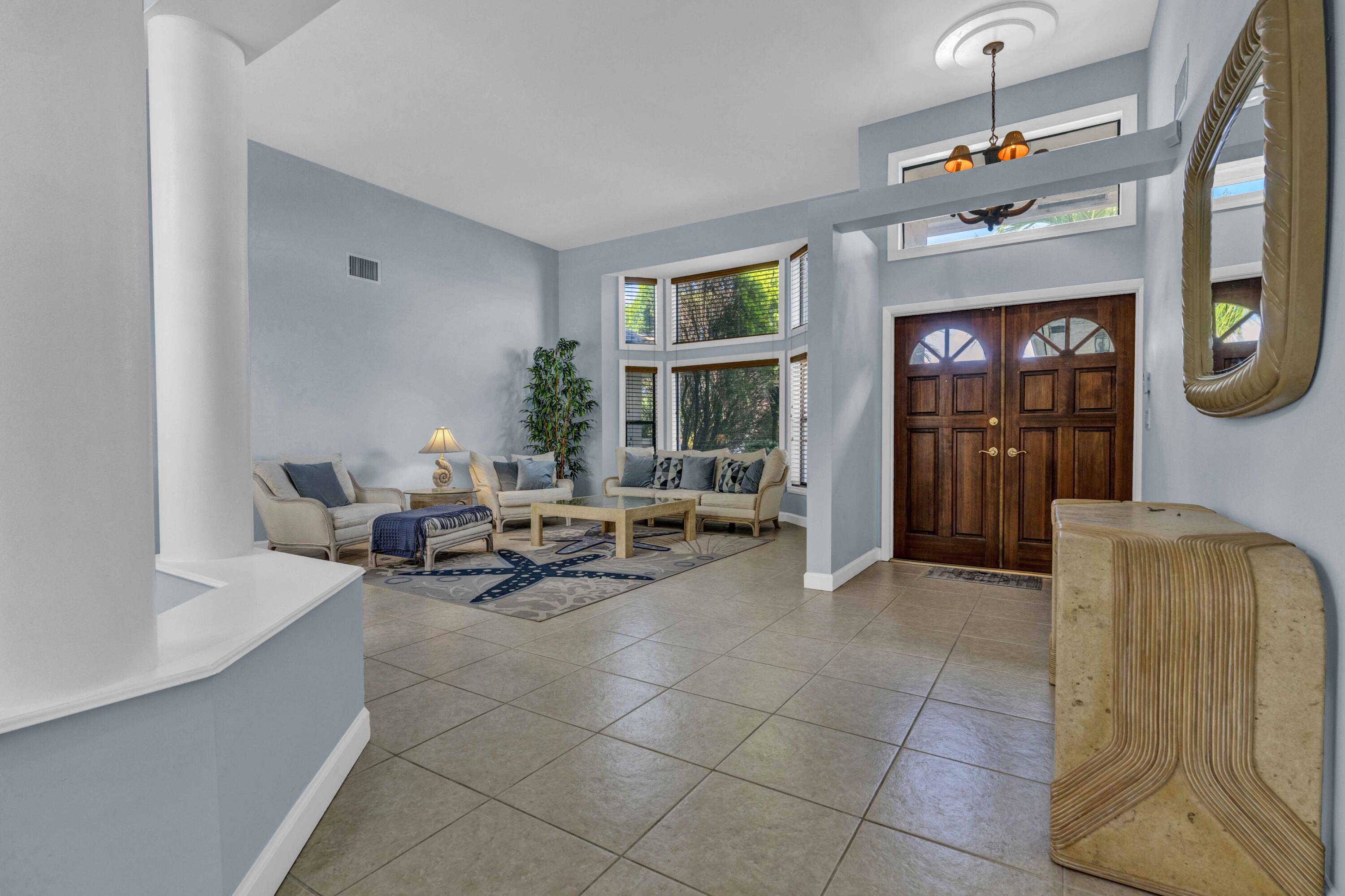 22323 Martella Avenue Boca Raton, FL 33433 - Photo 2 of 21 a living room with furniture and a window