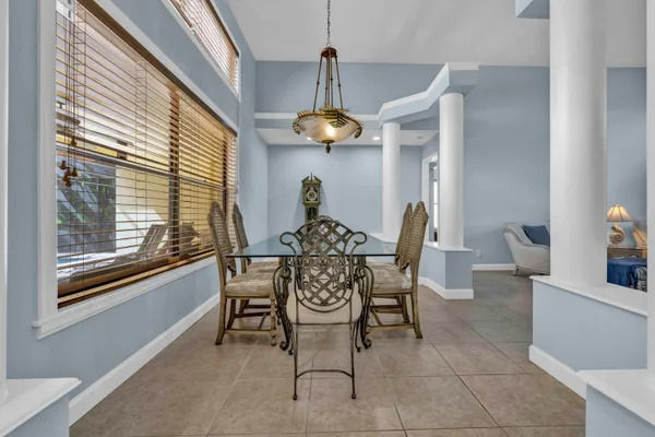 a dining room with furniture and window