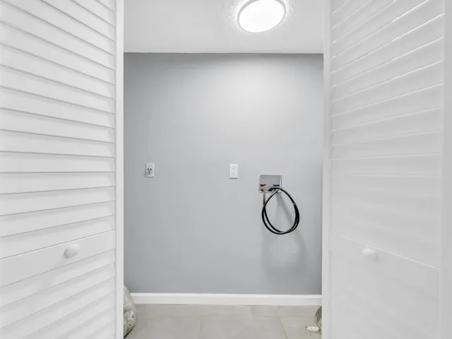 a bathroom with a shower a toilet and sink