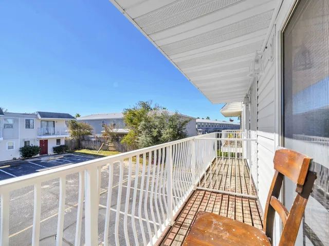 a view of balcony with furniture
