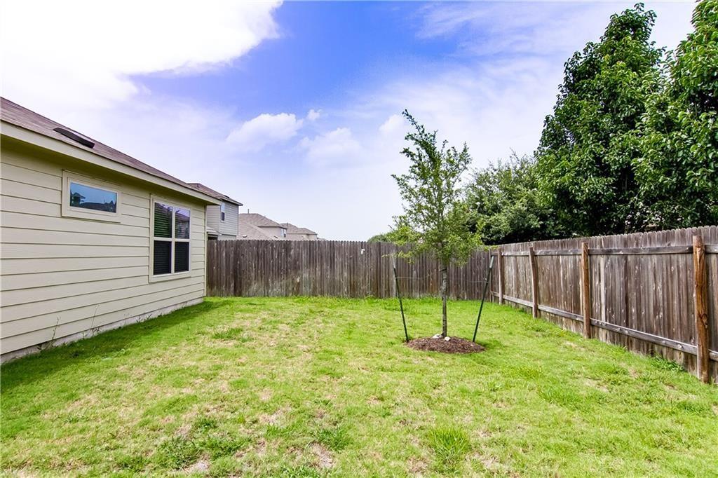 5916 Kennedy Street Austin, TX 78747 - Photo 22 of 25 a view of a backyard with a slide