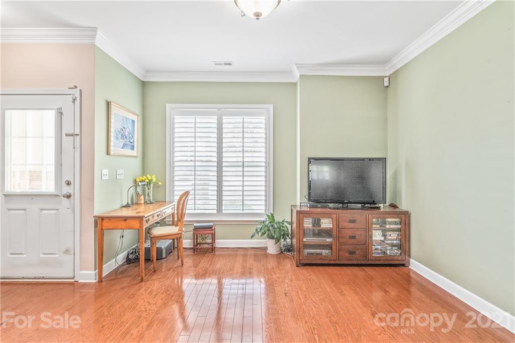 833 Millbrook Road, Unit 833 Charlotte, NC 28211 - Photo 11 of 23 a living room with furniture and a flat screen tv