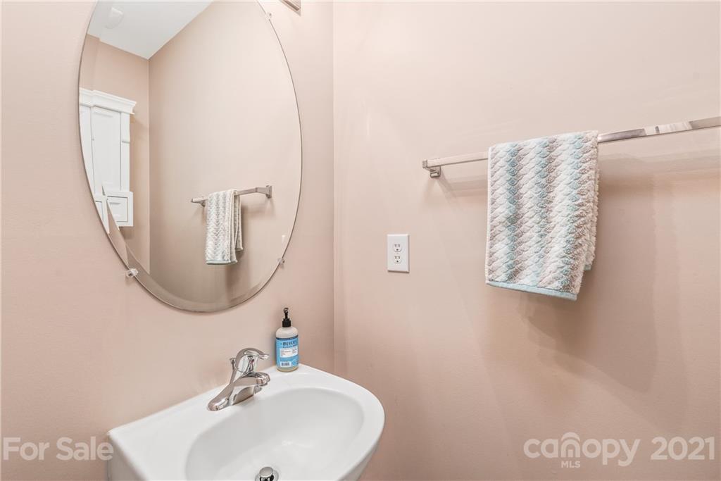 833 Millbrook Road, Unit 833 Charlotte, NC 28211 - Photo 12 of 23 a bathroom with a sink and a mirror