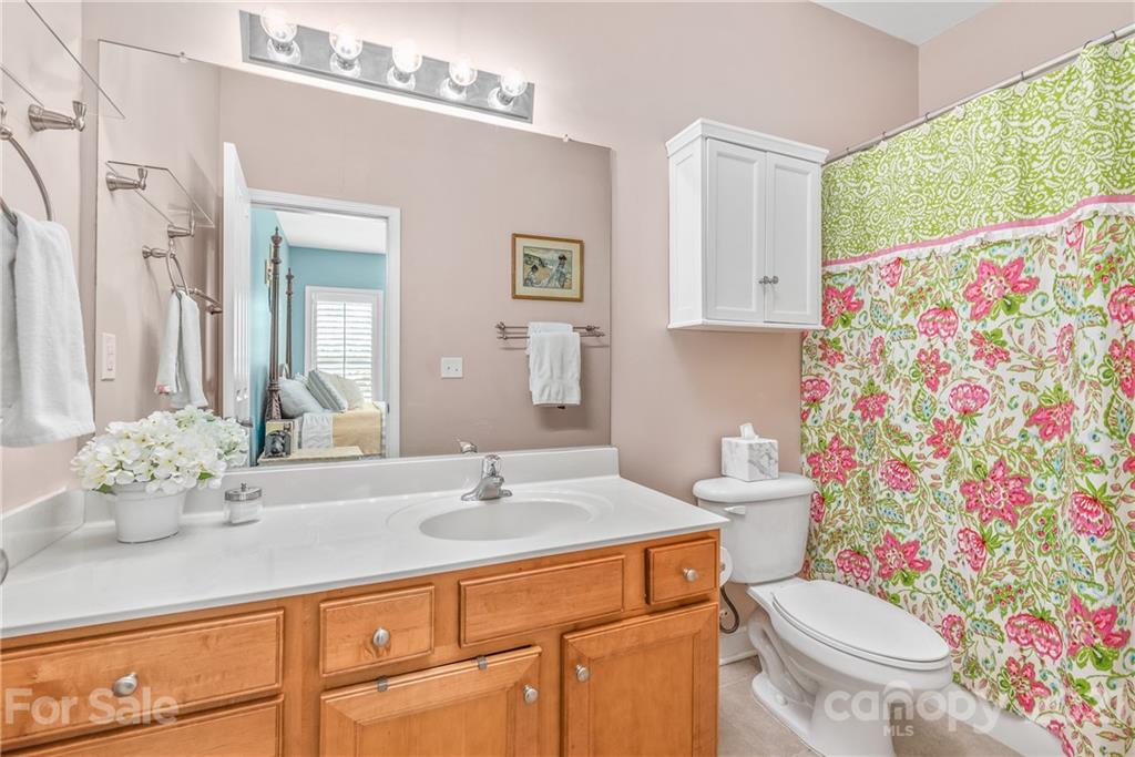 833 Millbrook Road, Unit 833 Charlotte, NC 28211 - Photo 15 of 23 a bathroom with a sink toilet and shower