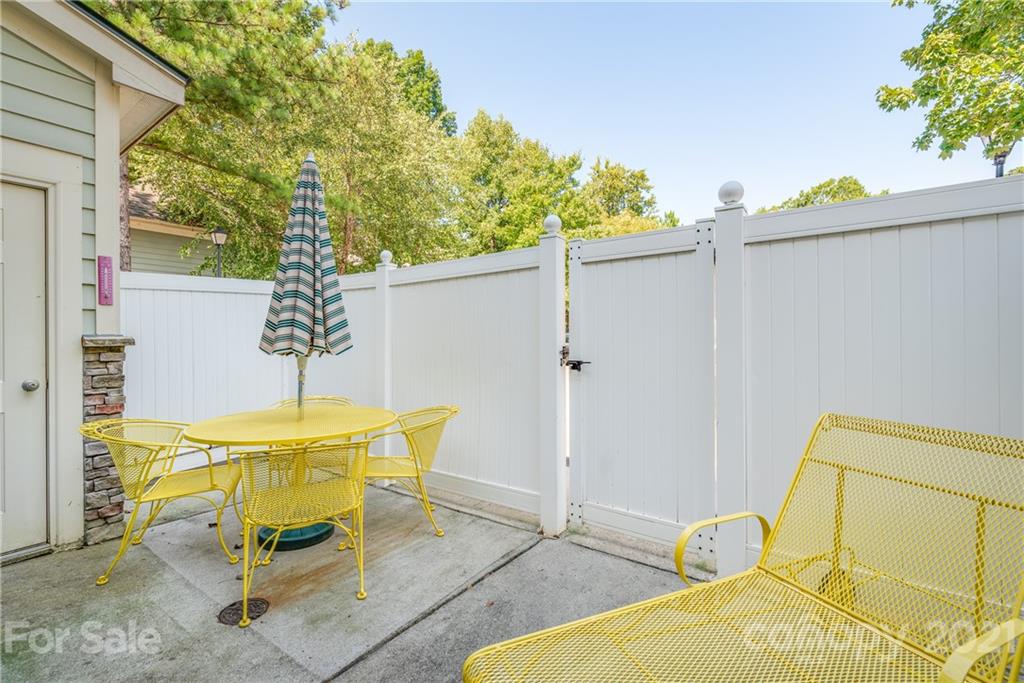 833 Millbrook Road, Unit 833 Charlotte, NC 28211 - Photo 20 of 23 a view of a swimming pool with a lounge chair