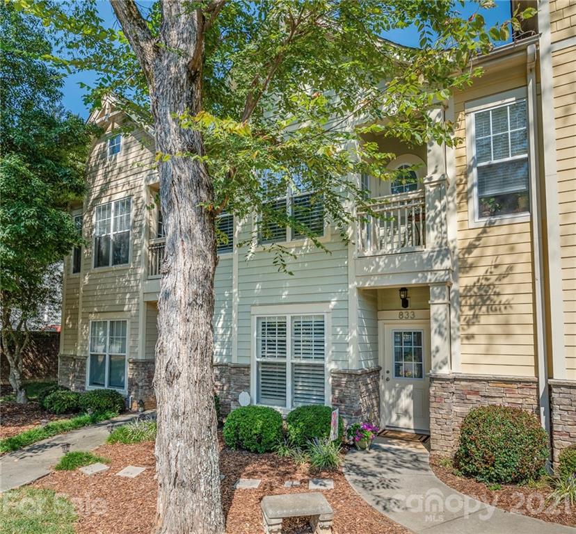 833 Millbrook Road, Unit 833 Charlotte, NC 28211 - Photo 3 of 23 a front view of a house with a tree