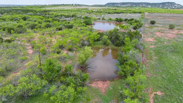 a view of a garden with a lake view