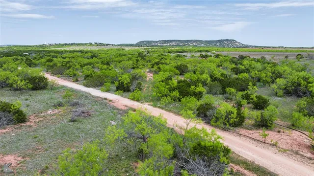 a view of a lake with houses in the back