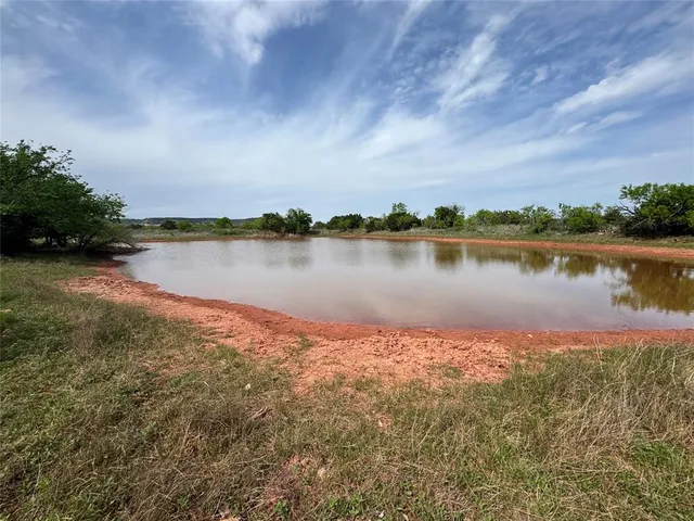 a view of swimming pool with a yard