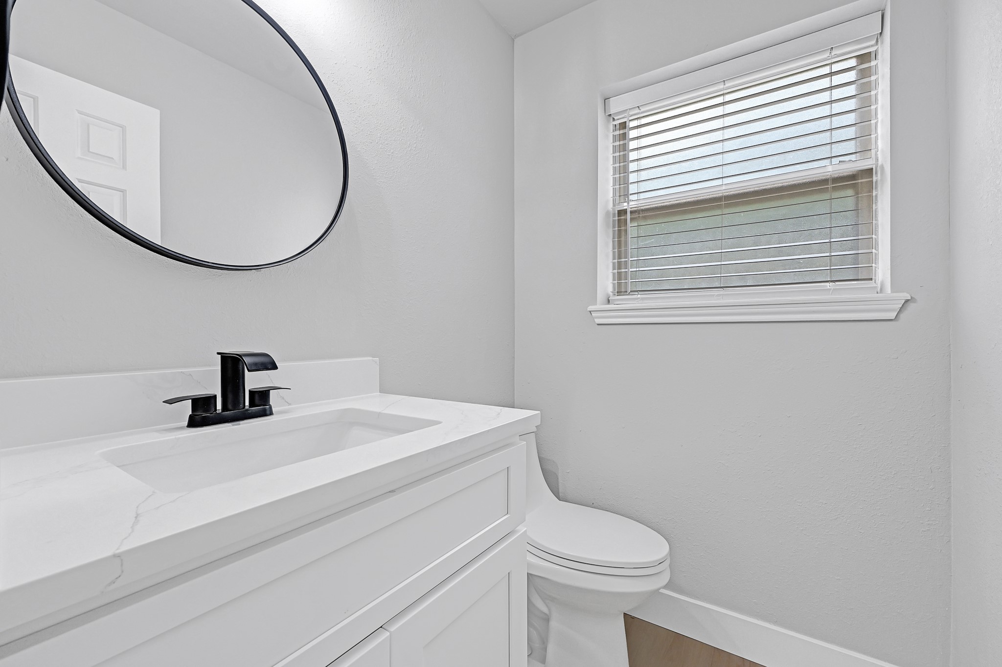 21211 Slippery Creek Lane Spring, TX 77388 - Photo 15 of 29 a bathroom with a sink a toilet and a mirror